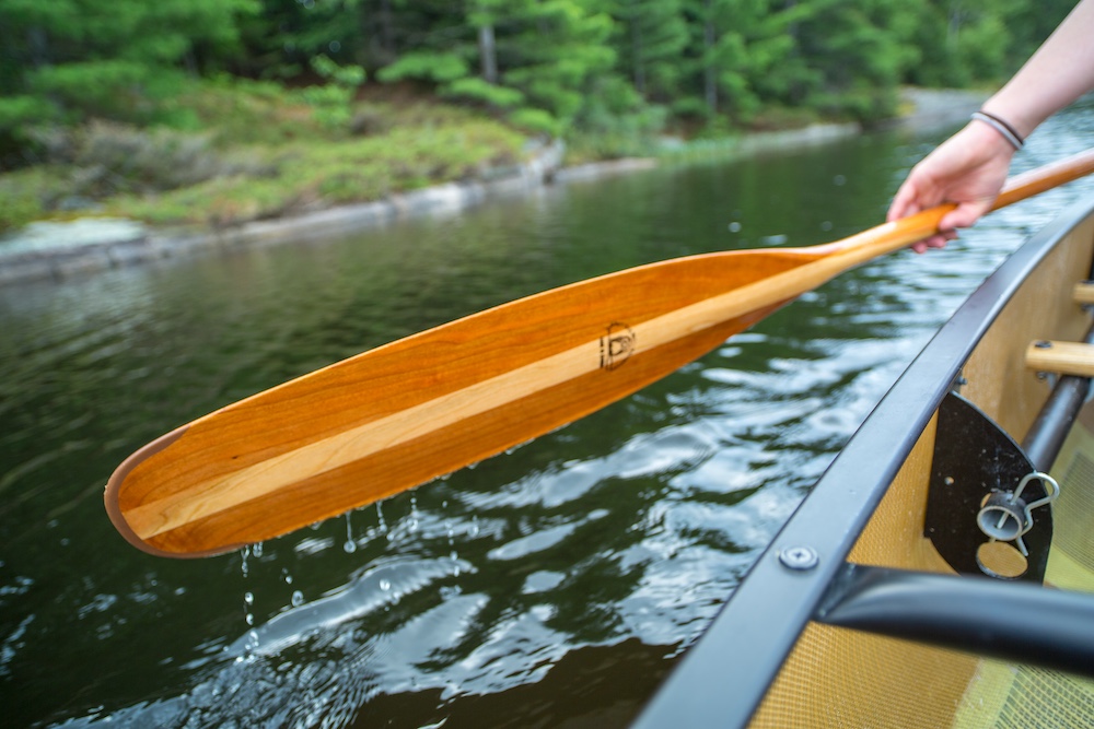 Close up of canoe paddle being used in a canoe