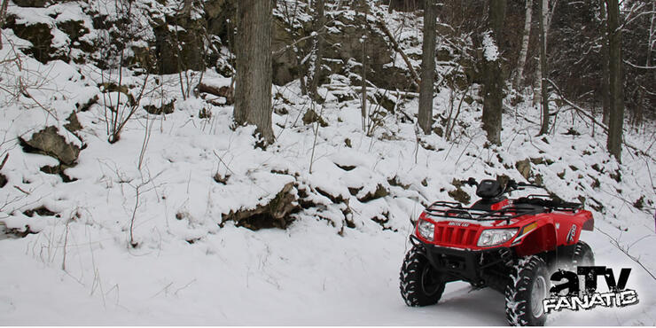 Arctic Cat 700 ATV in the snow 01