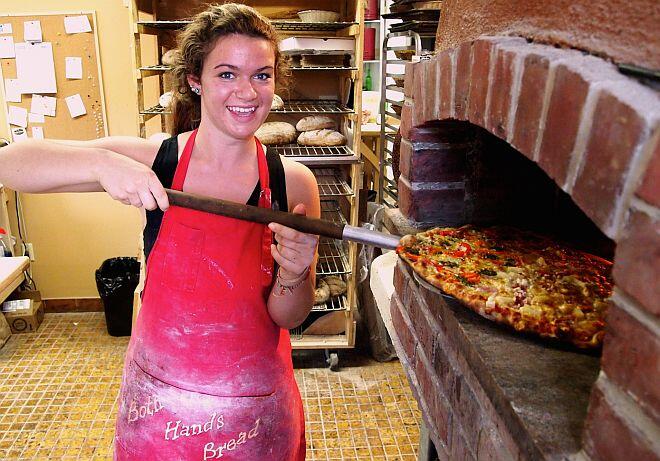 both hands pizza oven
