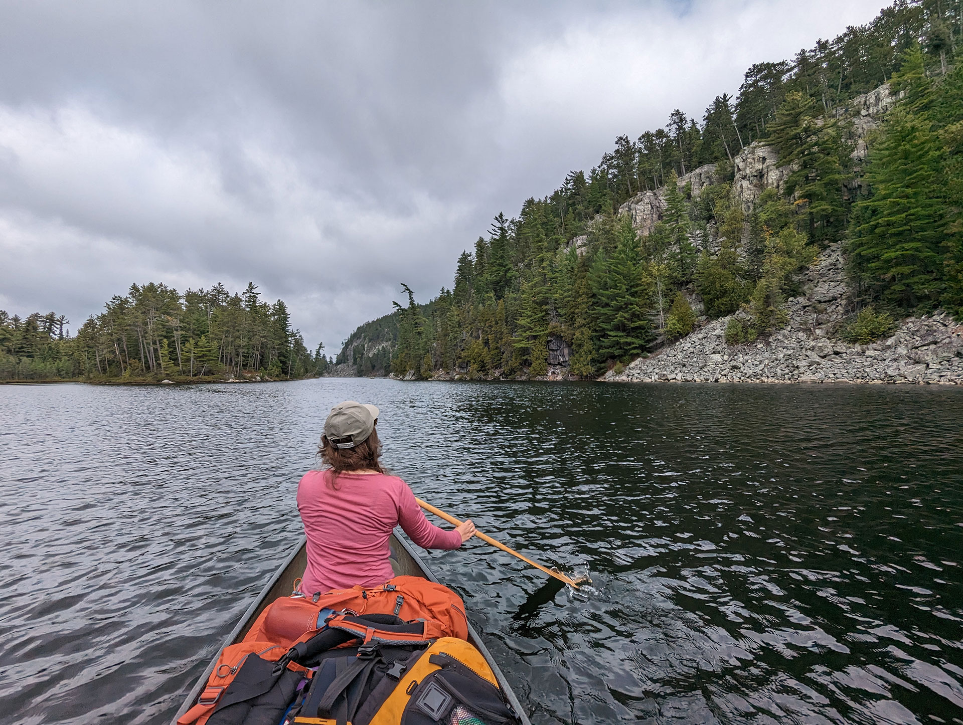 woman paddles a canoe on the Obabika River