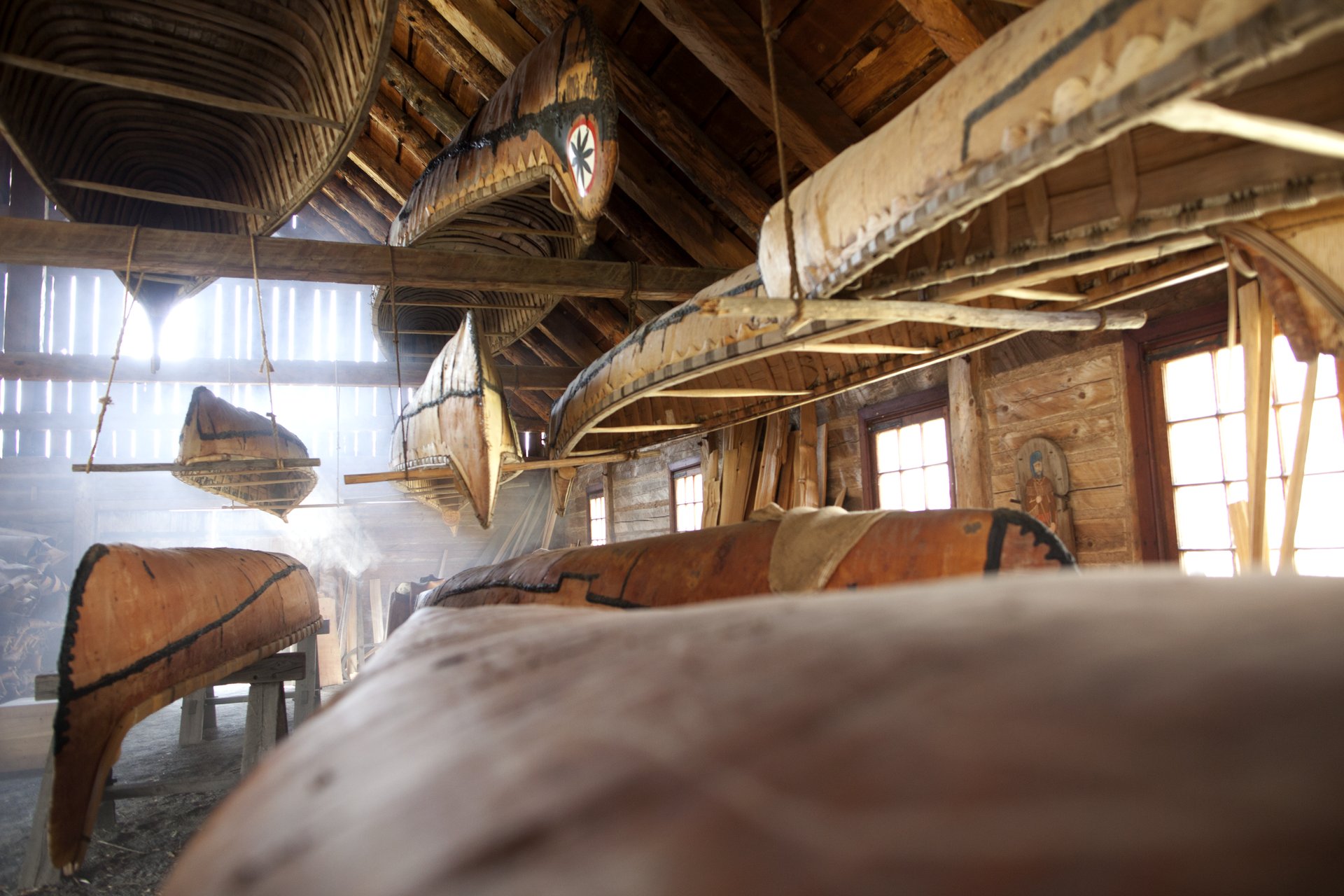 traditional canoes on display at Fort William Historical Park in Thunder Bay