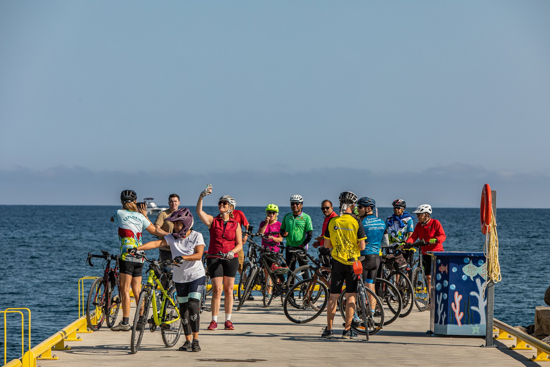 a group of cyclists pose for a group photo at Thornbury Marina