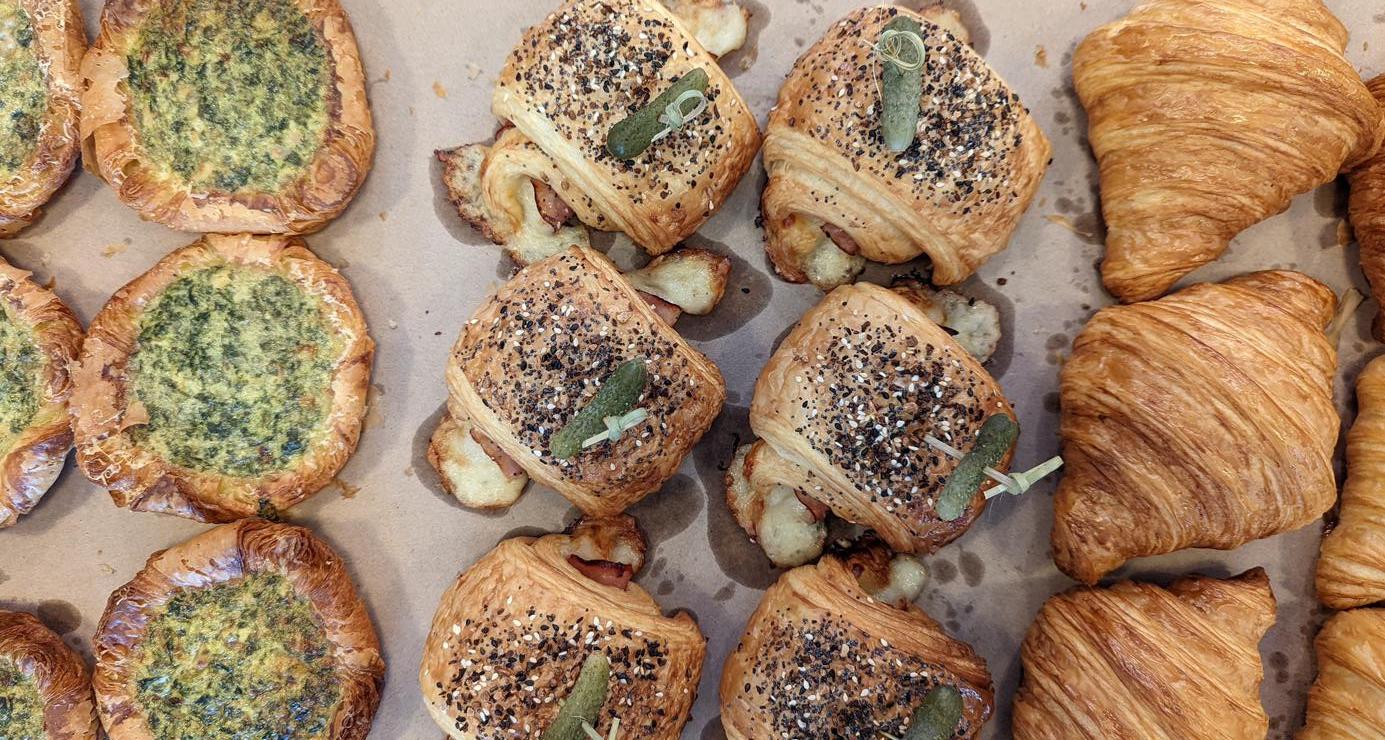 a pan of various delicious-looking croissants from Swell Bakery