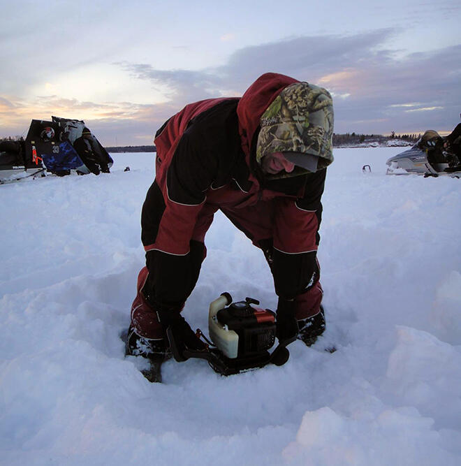 Jay Samsal using his augar with 3 feet of ice in mid-March 2014