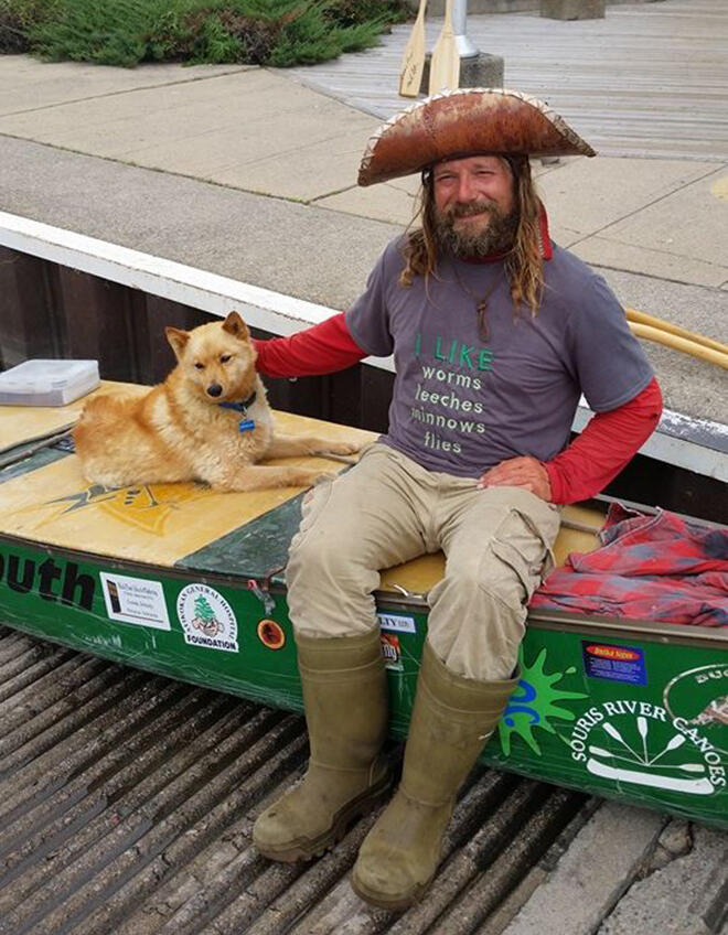 Mike Ranta and Spitzi after a 7 month paddle!