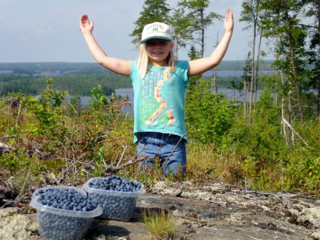 Kylie Kesanen shows off her bounty picked near <a href=