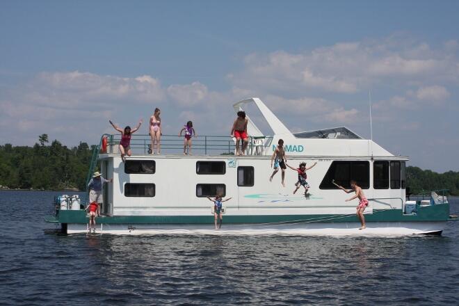 Having a blast jumping off the houseboat!