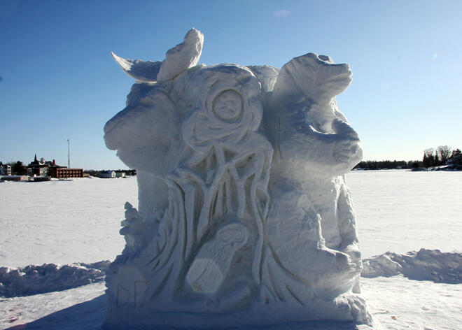 A four sided snow sculpture with wildlife on all sides!