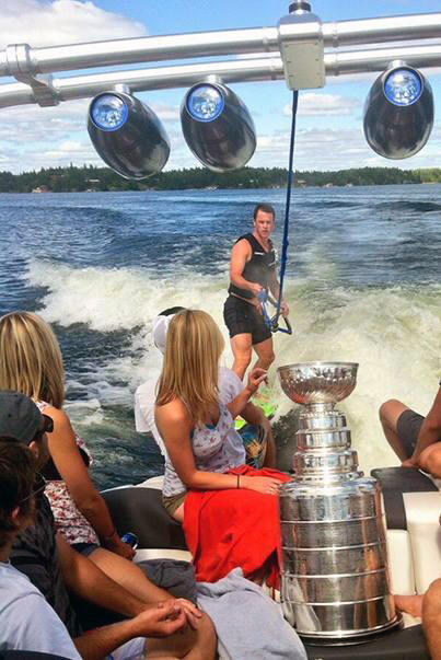 Jonathon Toews takes the Stanley Cup out for a day on Lake of the Woods