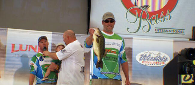 Showing off a bass caught at the Kenora Bass International.