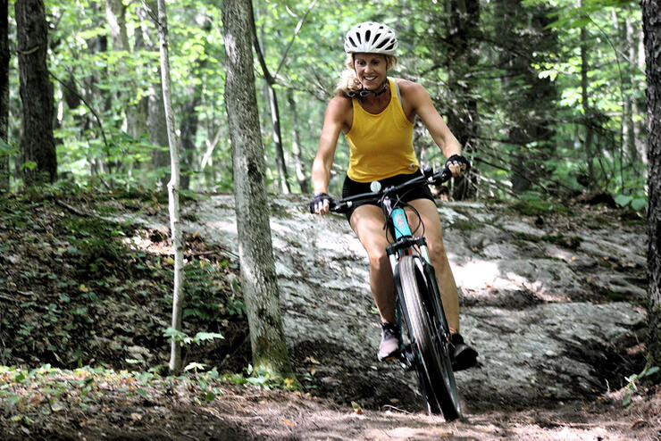 Connie brought a group of friends to the new NBMBA trail network at the end of Tower Drive. Stephanie Silverthorn is trying the brand trails for the first time. Photo: Connie Hergott