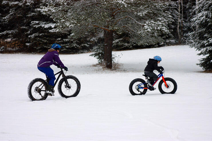 Connie and her son, Josh, fat biking on the campus trails of Nipissing University and Canadore College. Photo: Keith Dumoulin