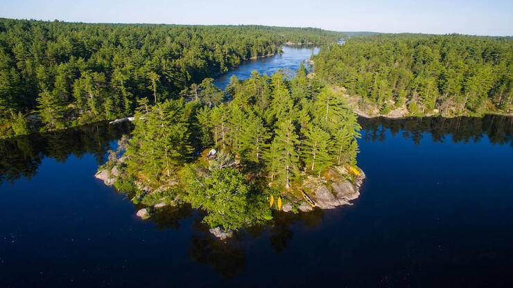 From the rugged hills and thick forests of the Canadian Shield to the channels, bays, and lakes that interconnect along this waterway, French River Provincial Park is a maze of quiet hideaways and fast-moving water.Â Source: Colin Field