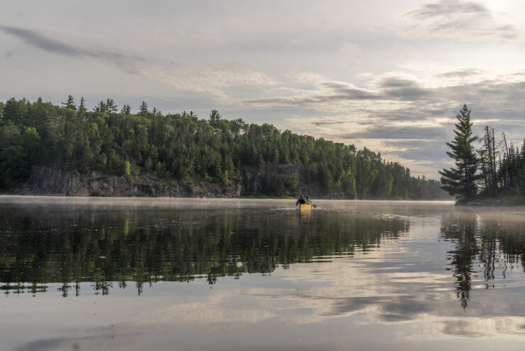 A lifting mist on Hamburg Lake, Quetico. Plan your own magical trip with the help of an experienced outfitter. Â Photo: David Jackson