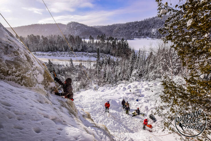 View of ice climbers on a steep ice face. 