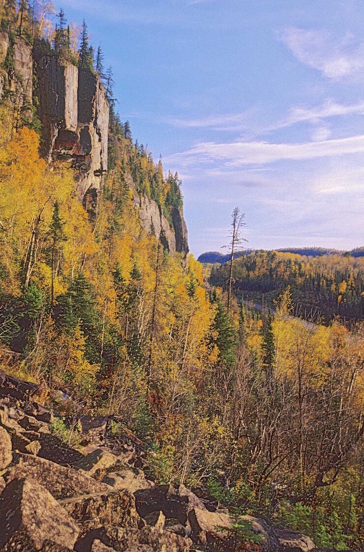 Majestic rock cliffs with boreal forest in fall.