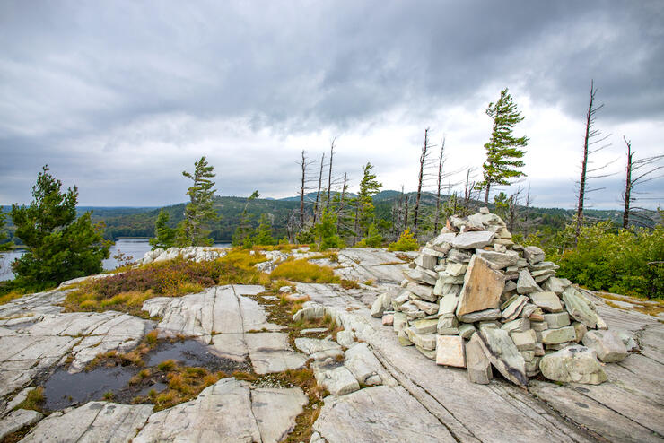 Rock cairn on a smooth rock landscape.