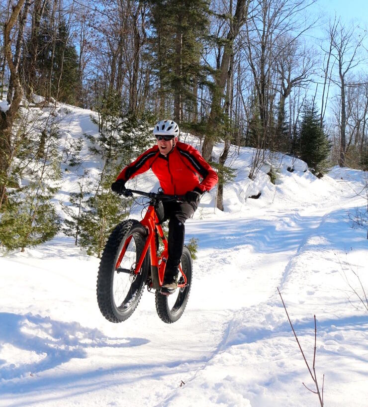 Man riding on fat bike in winter 