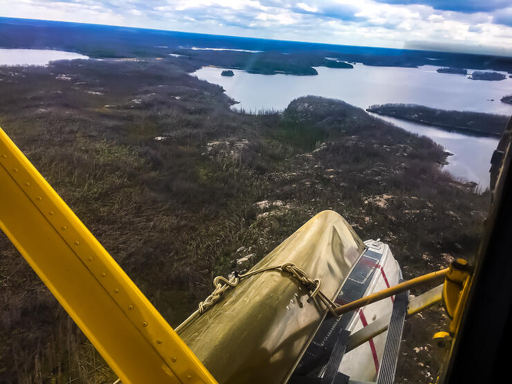 Canoe strapped to a floatplane pontoon 