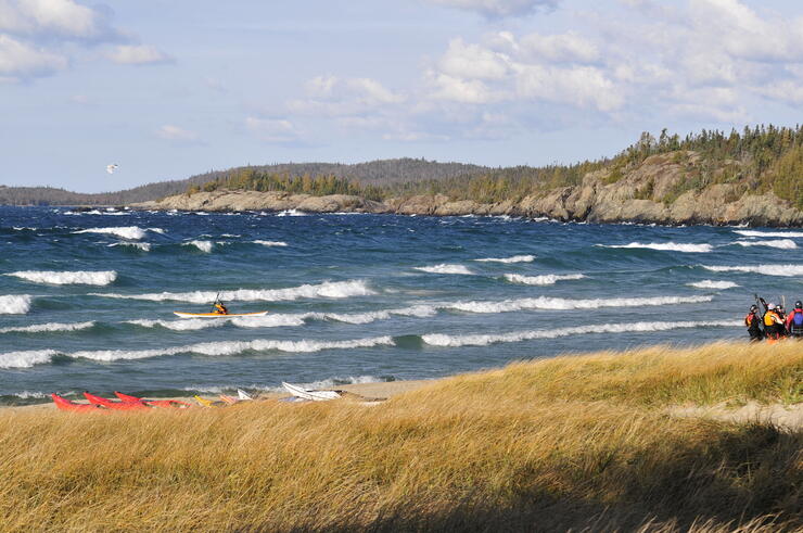 kayakers playing in waves