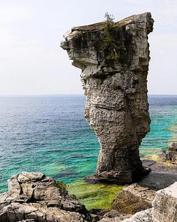 Tall rock formation on shore of Georgian Bay.