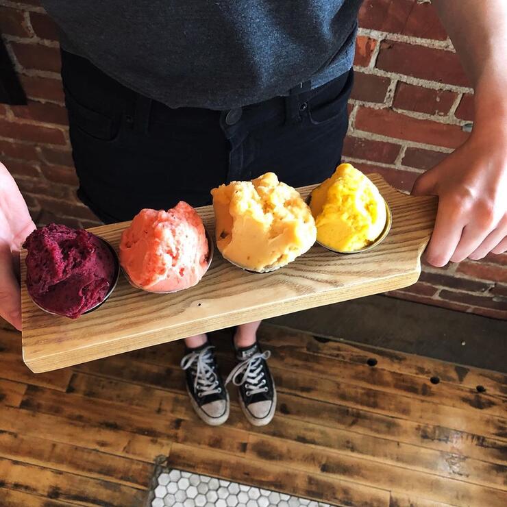 A flight of four flavours of gelato.