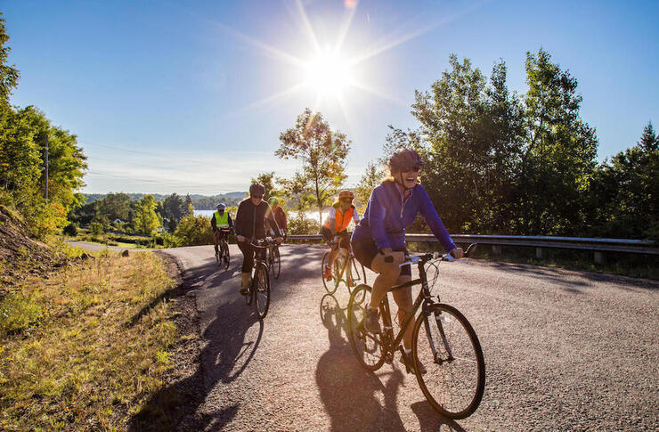 Group of cyclists riding on a country road