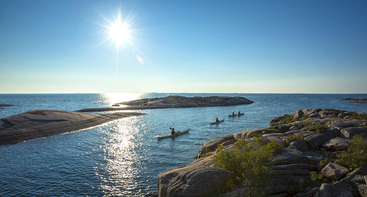 three kayak on turquoise waters of Georgian Bay