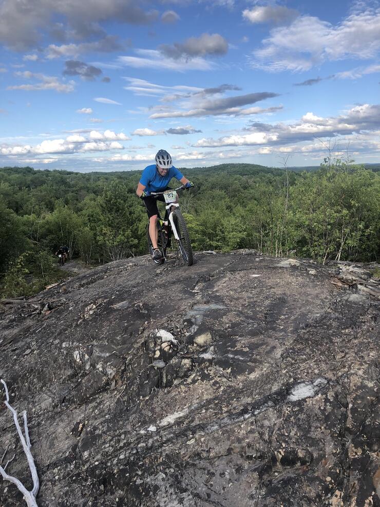 Man on a mountain bike at top of hill