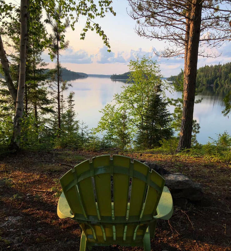 muskoka chair overlooking lake scene