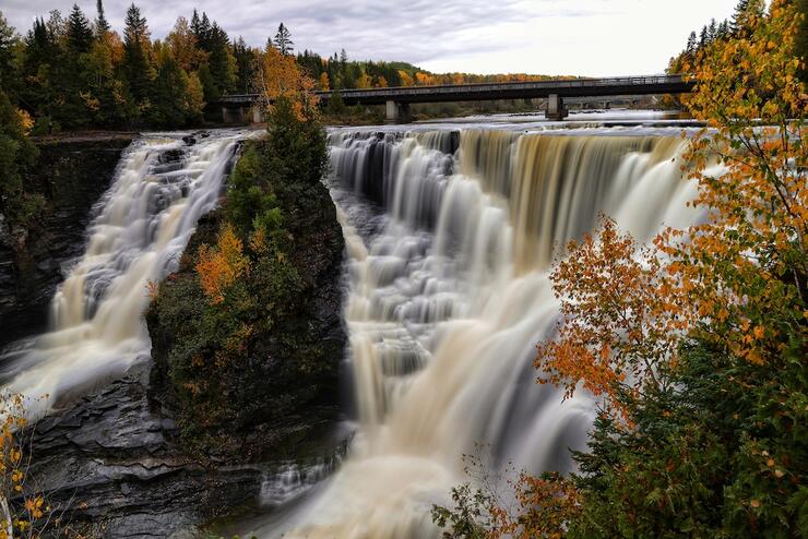 Waterfall framed by fall trees