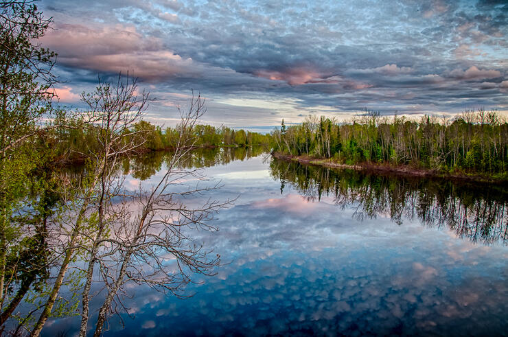 Photo of lake with colourful sky