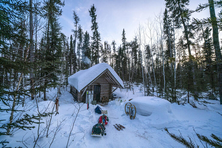 Snowy cabin in the Forest