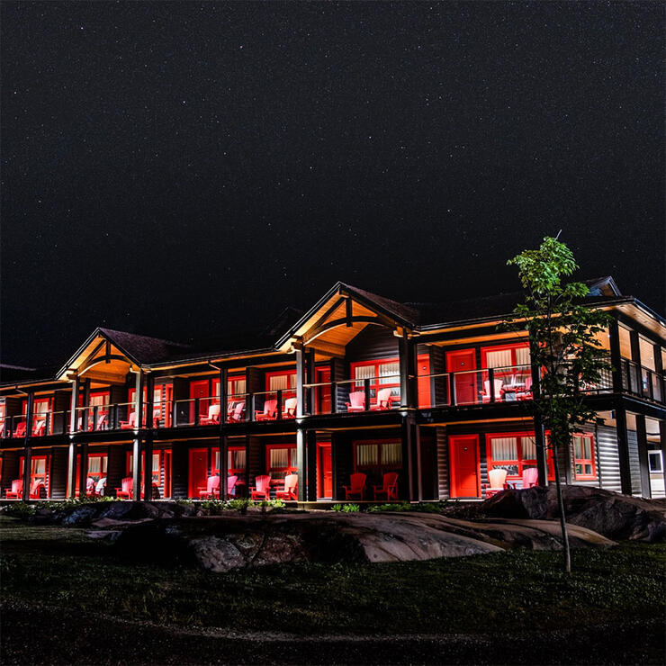 night-time photo of accommodations at Killarney Mountain Lodge
