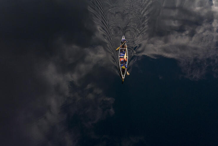 Overhead canoe shot on dark water