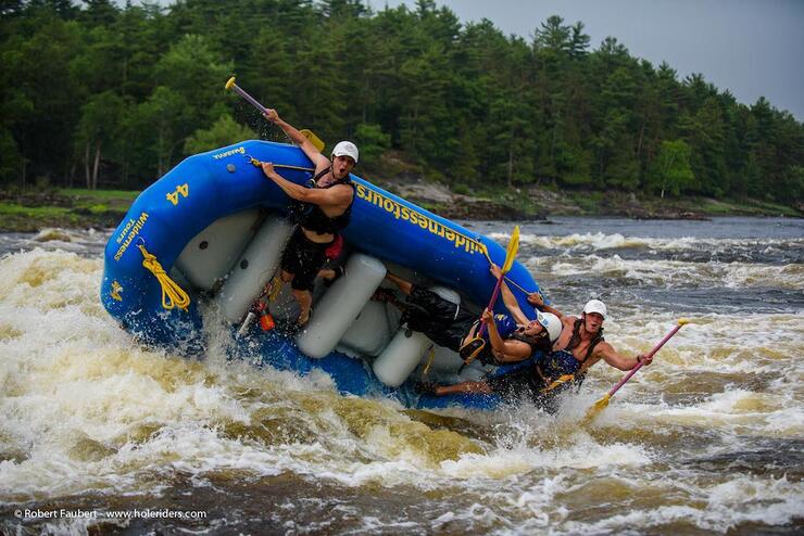 Blue raft flipping over