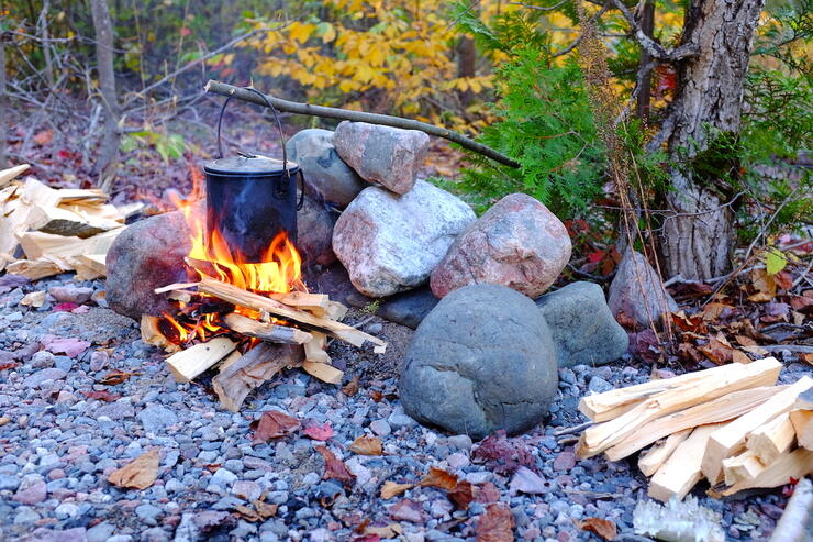 Pot hanging over campfire