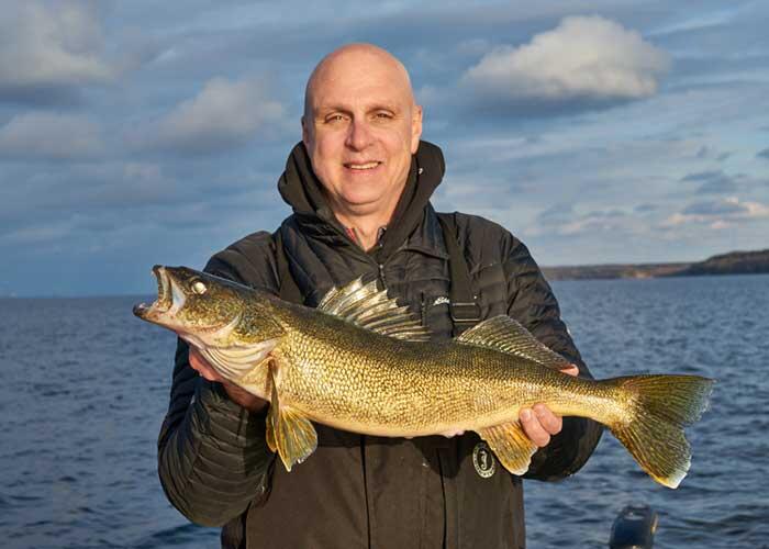 angler holding bay of quinte walleye
