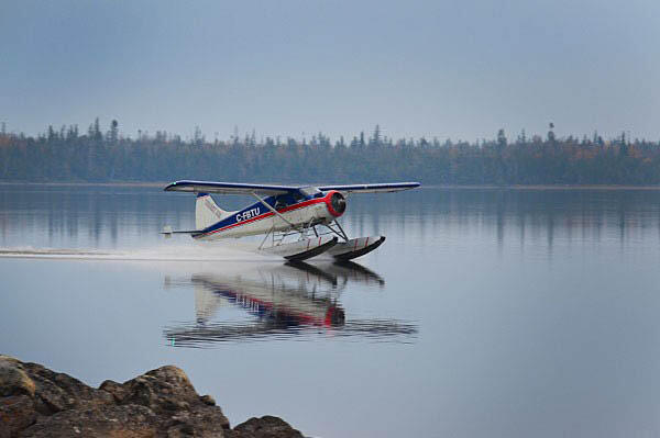 bushplane landing on lake