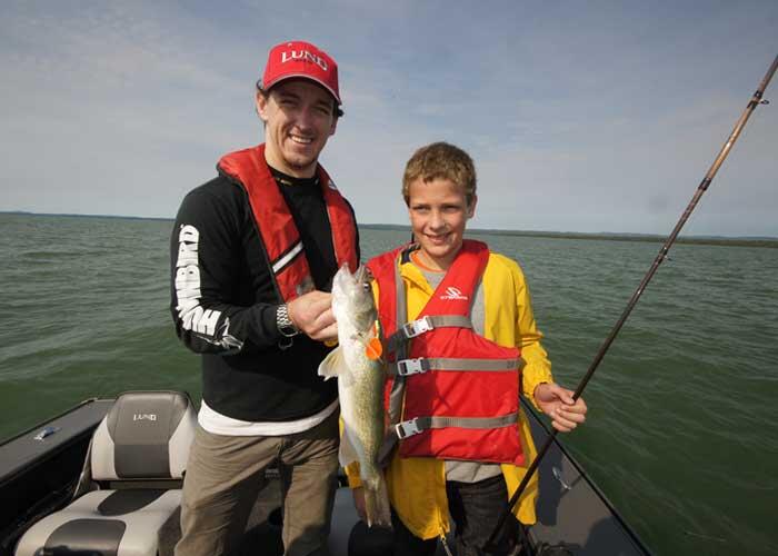 2 anglers with walleye