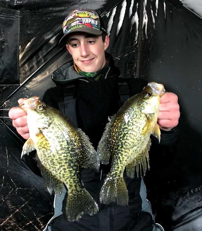 young angler with crappie
