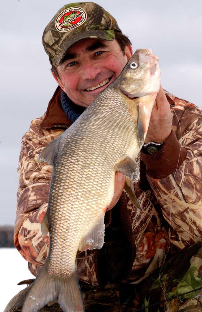 angler holding whitefish