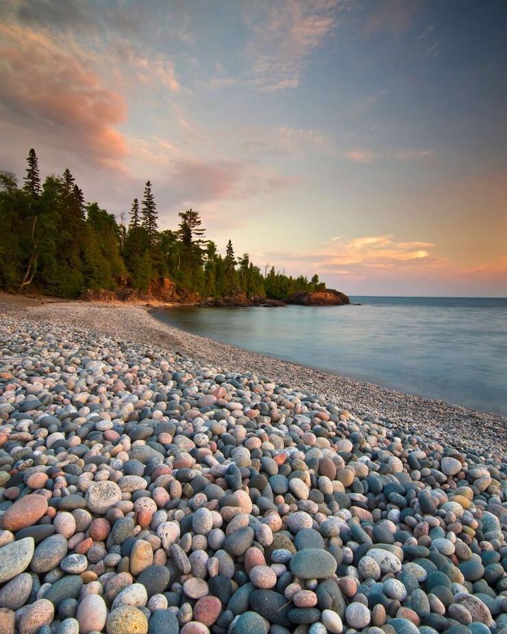 Pebble-covered beach along a lake