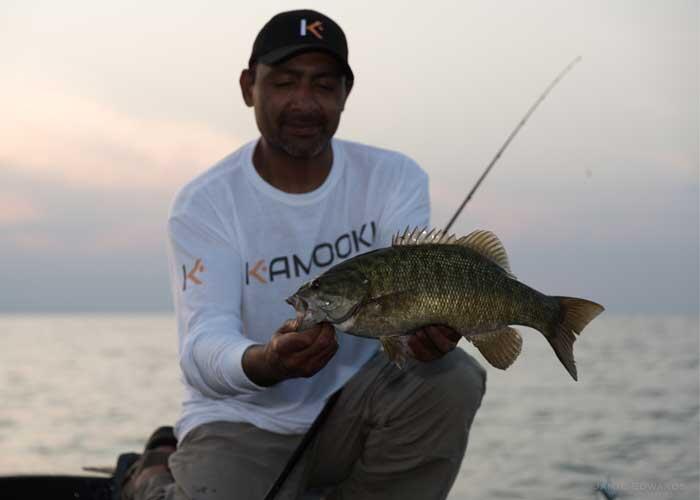 angler holding walleye