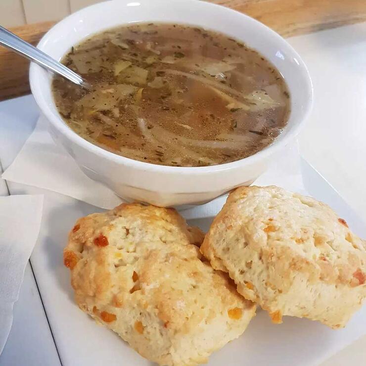 bowl of soup with biscuits