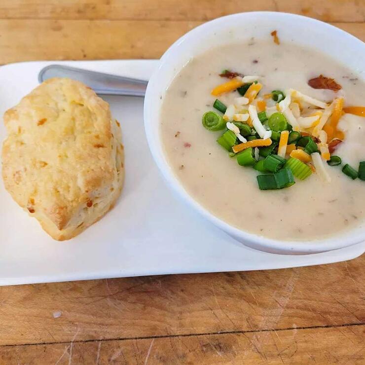 bowl of soup with biscuit