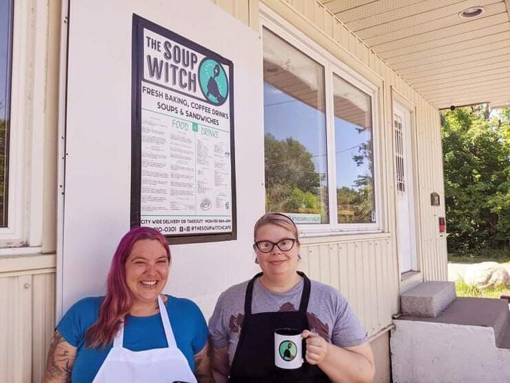 2 people outside restaurant